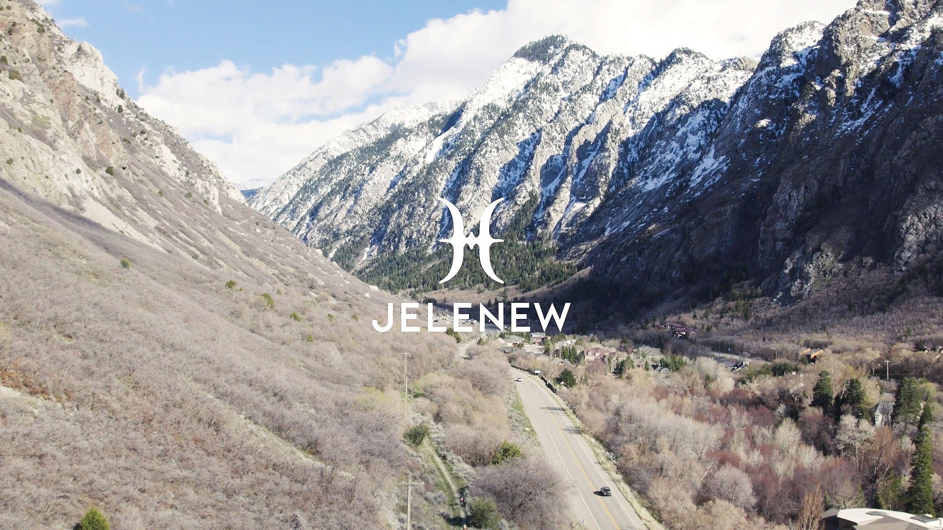 arial view of beautiful mountain pass, overlaid with Jelenew logo